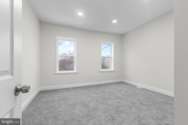 unfurnished room with baseboards, carpet flooring, and recessed lighting