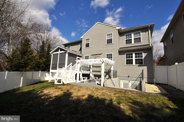 back of property featuring a sunroom, a fenced backyard, a yard, and a pergola