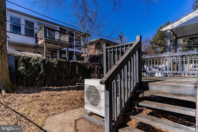 exterior space featuring a deck and ac unit