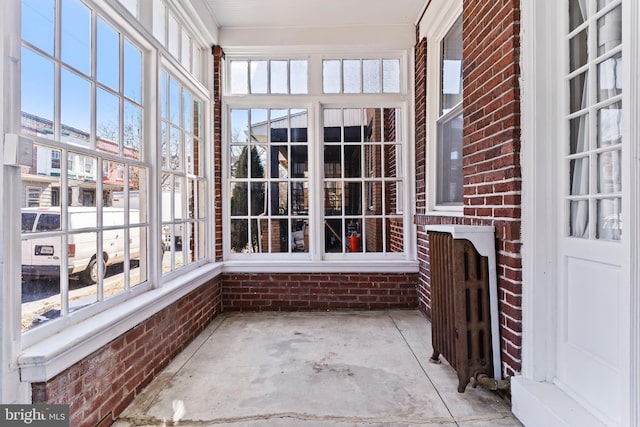 unfurnished sunroom with a healthy amount of sunlight