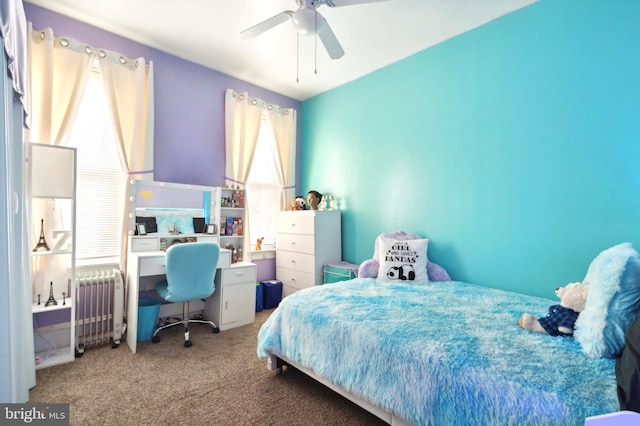 bedroom with radiator, ceiling fan, and carpet floors