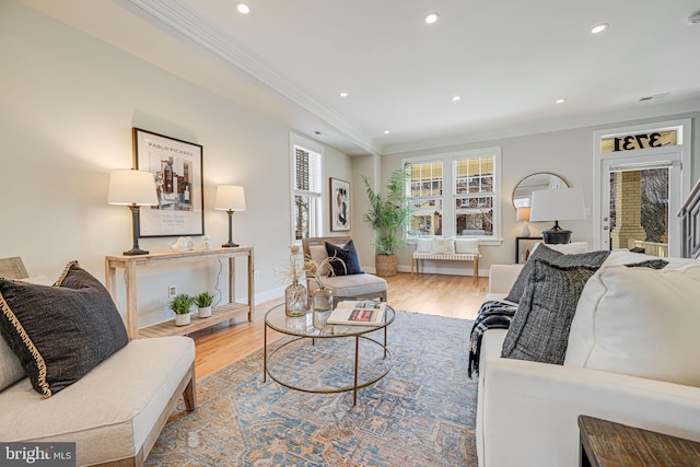 living room featuring recessed lighting, wood finished floors, and ornamental molding