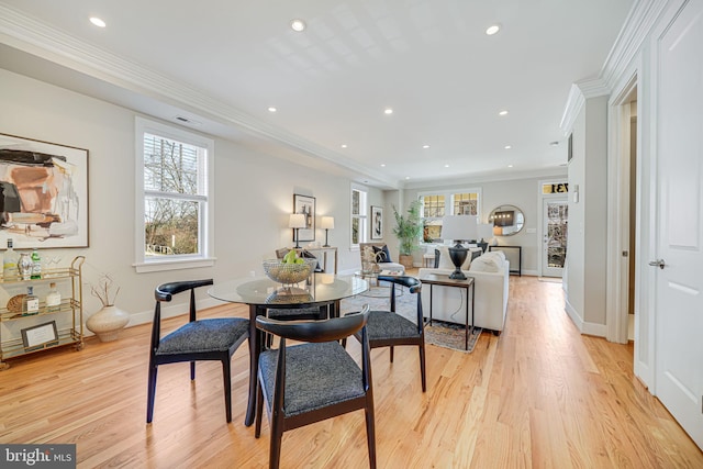 dining room featuring recessed lighting, light wood-style flooring, and crown molding