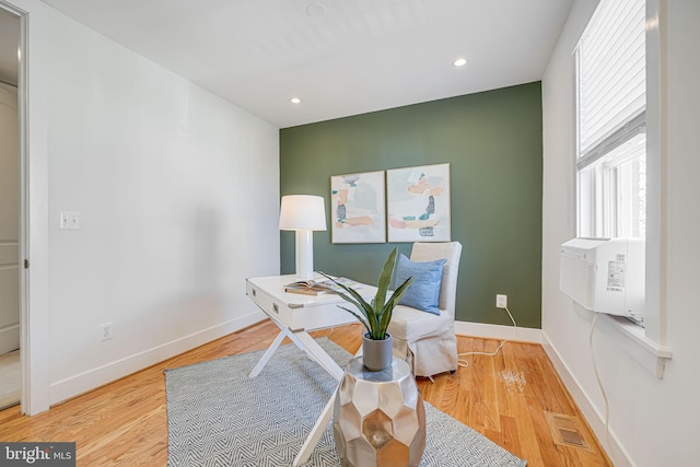 office area with recessed lighting, wood finished floors, visible vents, and baseboards