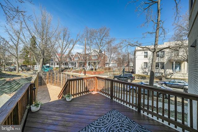 wooden terrace with a residential view