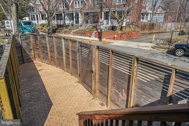 exterior space featuring a residential view and fence private yard