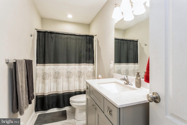 bathroom with toilet and vanity