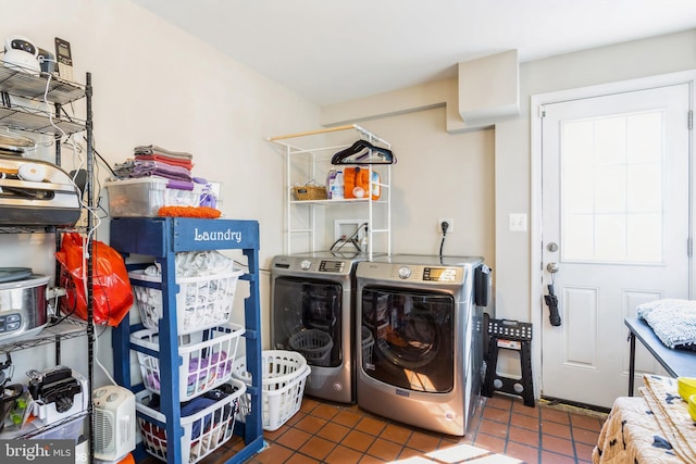 laundry room with tile patterned floors, laundry area, and separate washer and dryer