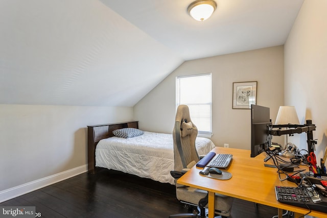 bedroom featuring lofted ceiling, baseboards, and hardwood / wood-style floors