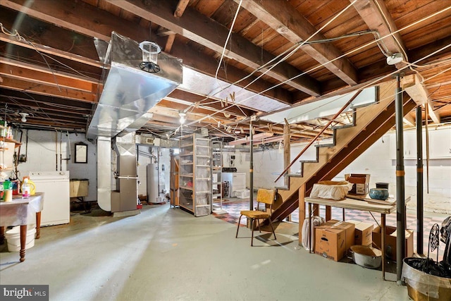 unfinished basement with stairs, washer / dryer, water heater, and a sink