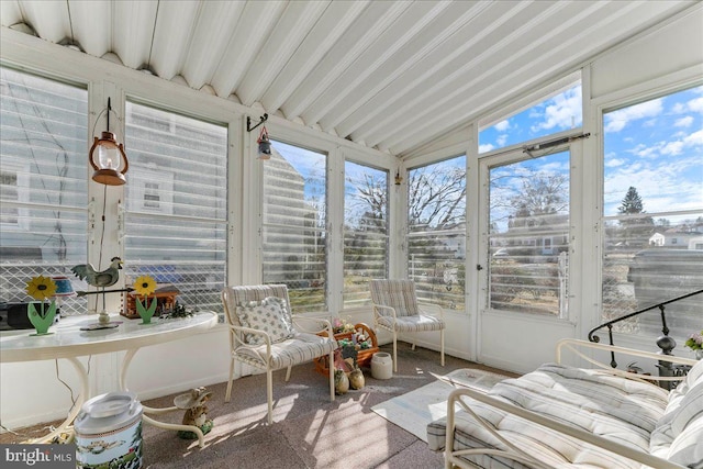 sunroom / solarium with vaulted ceiling