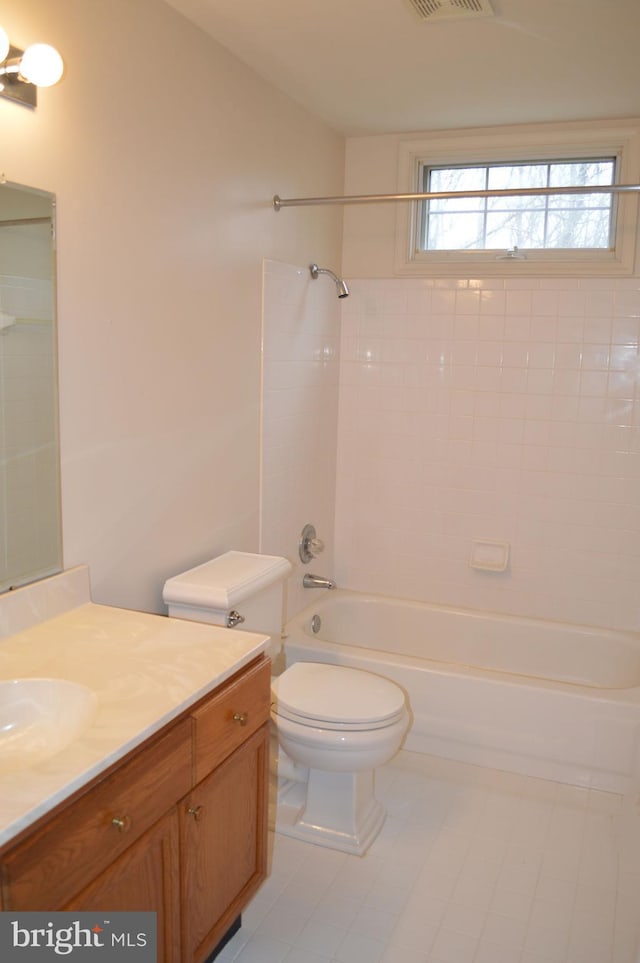 bathroom with visible vents, vanity, toilet, and shower / tub combination