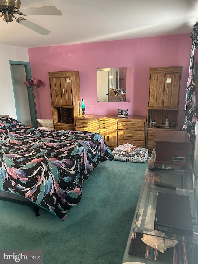 carpeted bedroom featuring a ceiling fan