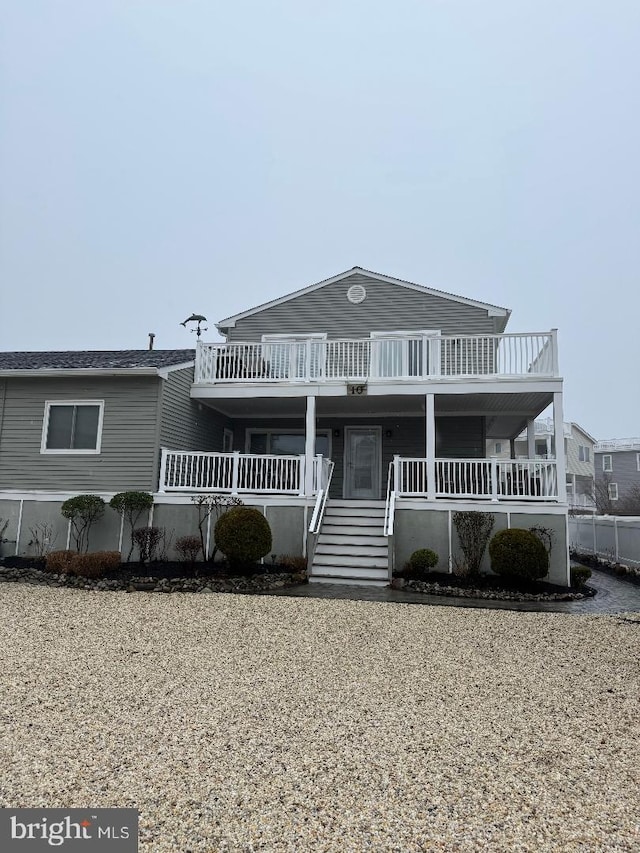 10 W Essex Ave, Harvey Cedars, NJ 08008 - view of front facade with a porch and stairs