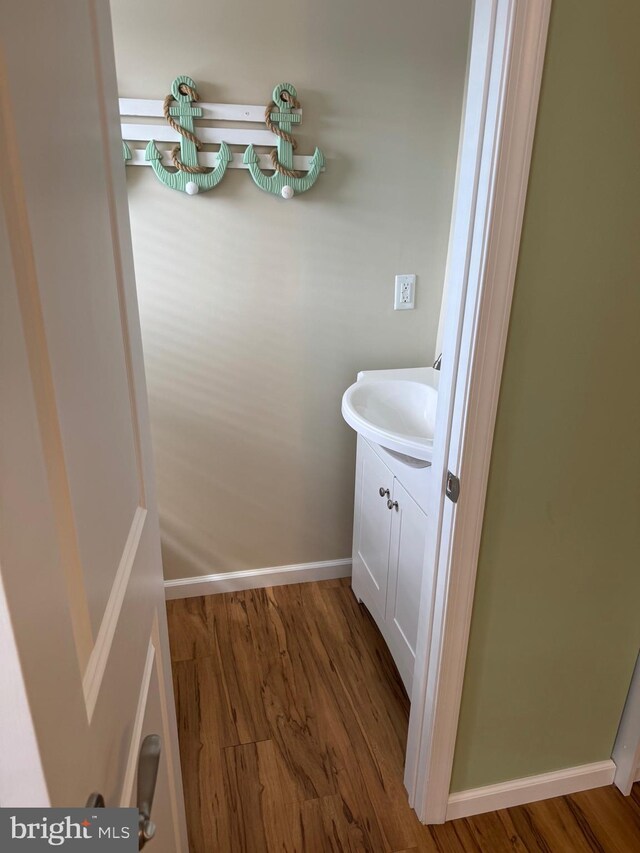 10 W Essex Ave, Harvey Cedars, NJ 08008 - bathroom featuring wood finished floors, vanity, and baseboards
