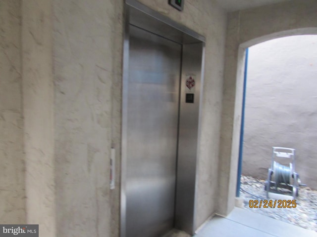 doorway to property featuring elevator