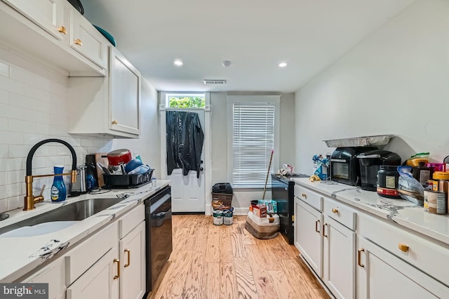 5312 Cordelia Ave, Baltimore, MD 21215 - kitchen featuring dishwasher, light wood-type flooring, white cabinets, light countertops, and recessed lighting