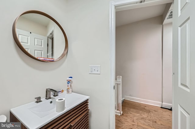 5312 Cordelia Ave, Baltimore, MD 21215 - bathroom with vanity and wood finished floors