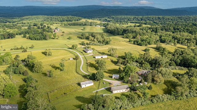 bird's eye view featuring a rural view, a mountain view, and a forest view