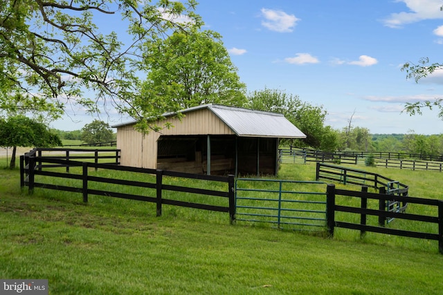view of stable with a rural view