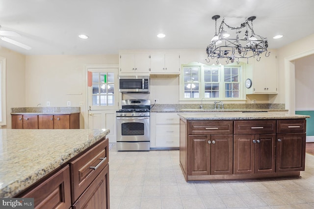kitchen featuring white cabinetry, appliances with stainless steel finishes, a sink, and recessed lighting