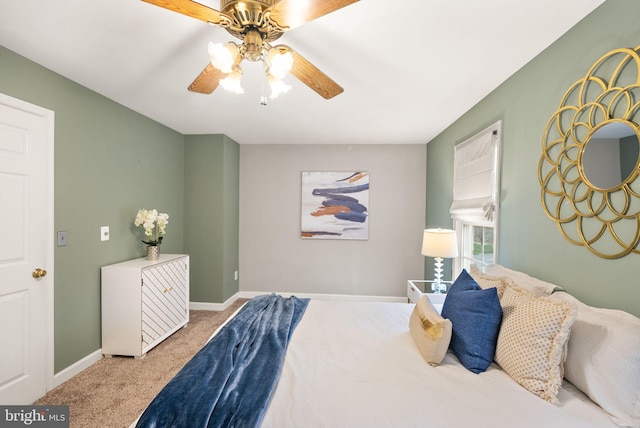 bedroom featuring carpet, a ceiling fan, and baseboards