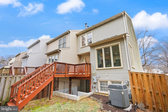 rear view of property featuring stairway, fence, cooling unit, and a wooden deck