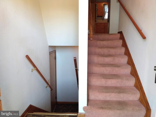 stairway with baseboards