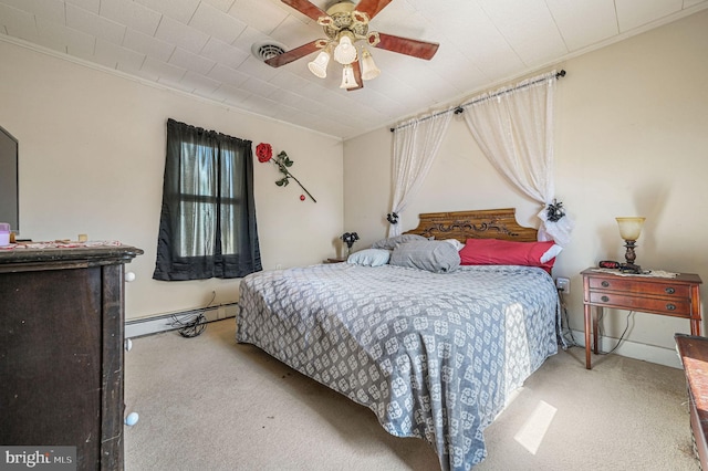 carpeted bedroom with a ceiling fan, baseboard heating, visible vents, and crown molding