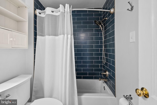 bathroom featuring toilet and shower / bath combo