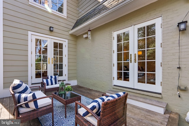 wooden deck featuring an outdoor living space and french doors