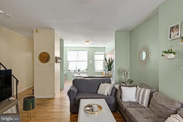 living room featuring baseboards and wood finished floors