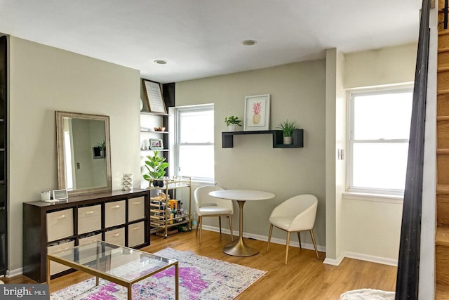 interior space featuring baseboards and wood finished floors