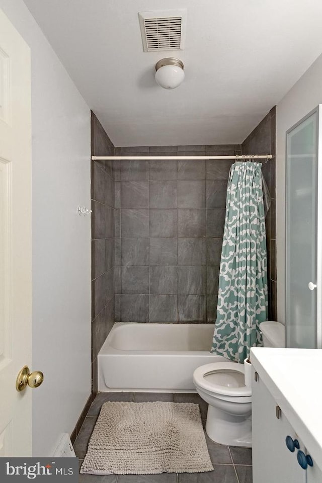 full bathroom featuring shower / bath combo, visible vents, toilet, tile patterned floors, and vanity