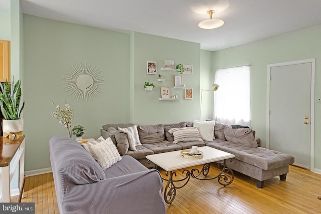 living room featuring light wood-style floors and baseboards