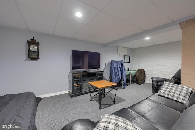 living room with carpet flooring, recessed lighting, baseboards, and a drop ceiling