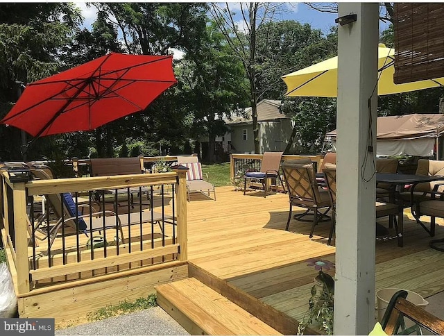 wooden deck with outdoor dining area