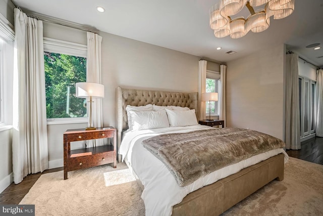 bedroom featuring a notable chandelier, visible vents, recessed lighting, and baseboards