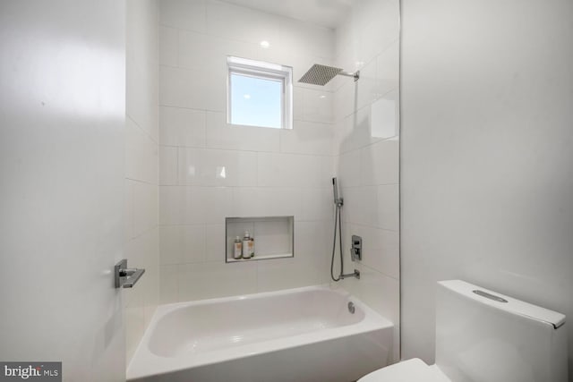 bathroom with shower / washtub combination and toilet