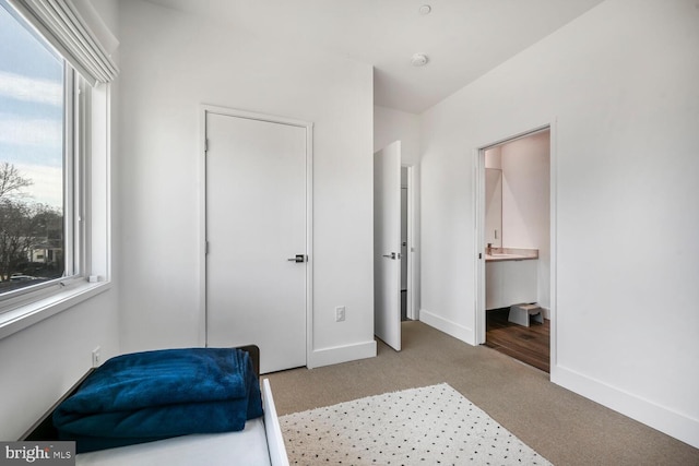 bedroom featuring baseboards and carpet floors