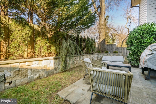 view of patio / terrace featuring outdoor lounge area and a fenced backyard