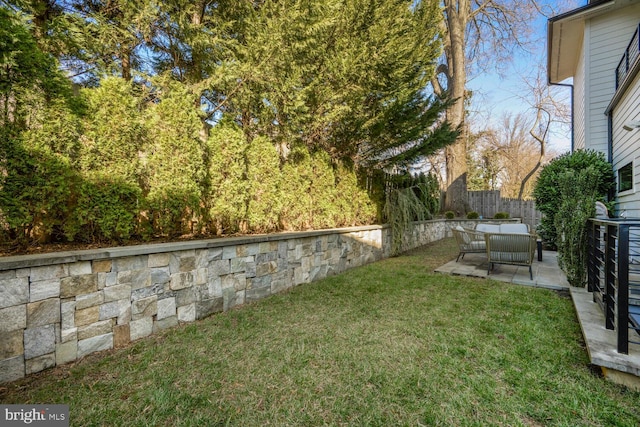 view of yard with fence and a patio area