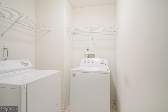 laundry room with laundry area and washer and clothes dryer