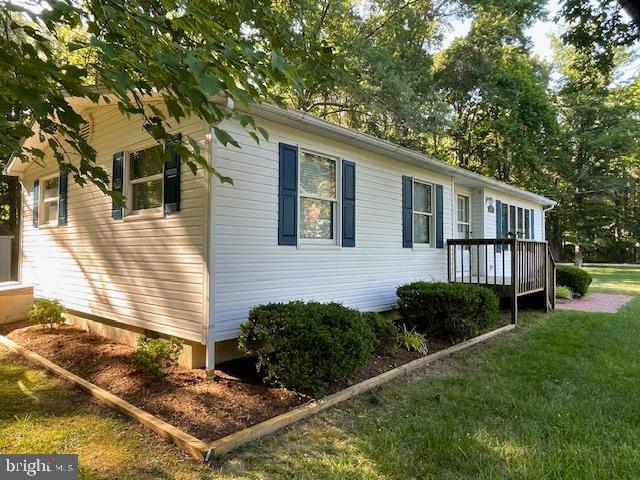 view of home's exterior with a yard