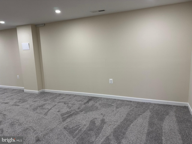 spare room with visible vents, recessed lighting, baseboards, and carpet