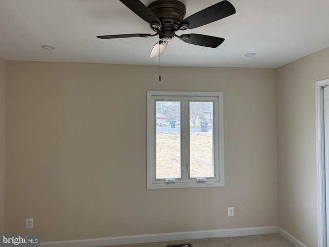 spare room featuring visible vents, baseboards, and carpet floors