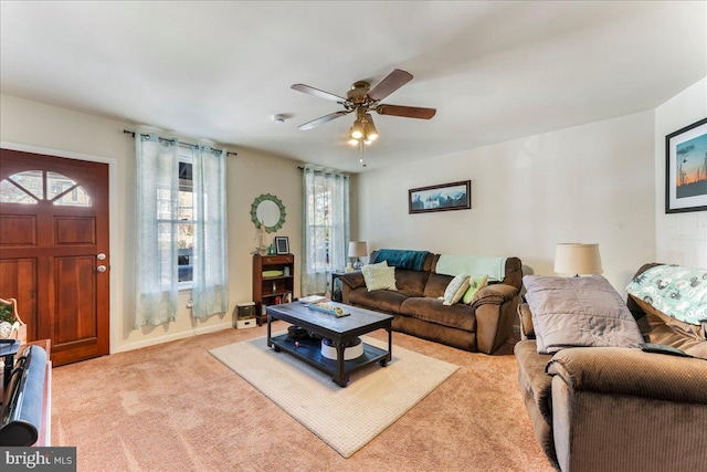 living room featuring ceiling fan and light colored carpet