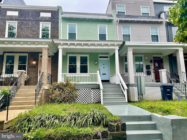 1707 D St SE, Washington, DC 20003 - view of front of property featuring covered porch, stairs, and brick siding