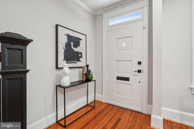 1707 D St SE, Washington, DC 20003 - entryway with baseboards, wood finished floors, and ornamental molding