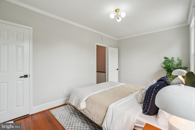 1707 D St SE, Washington, DC 20003 - bedroom featuring hardwood / wood-style flooring, ornamental molding, and baseboards